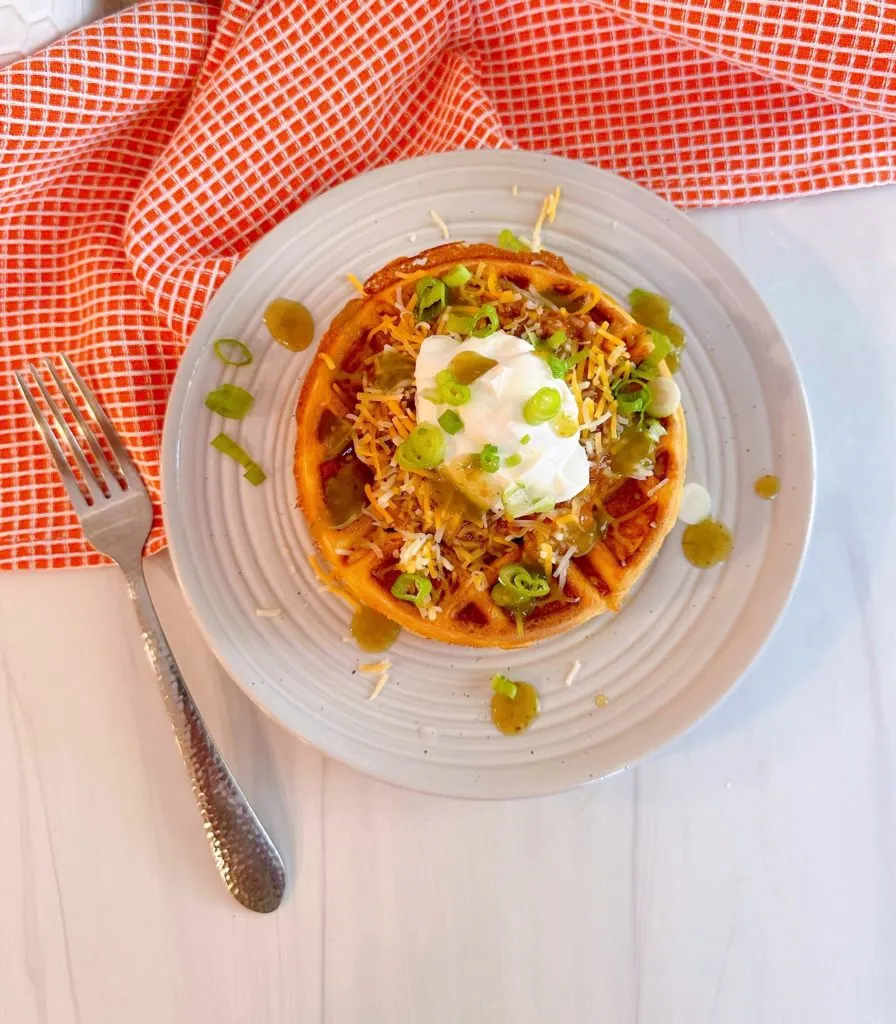 Overhead shot of stuffed cornbread waffle with chili.