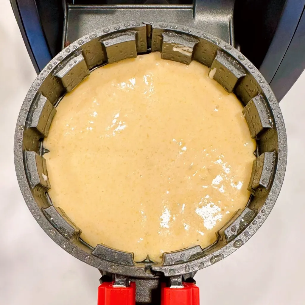 Cornbread is poured into a stuffed waffle maker.