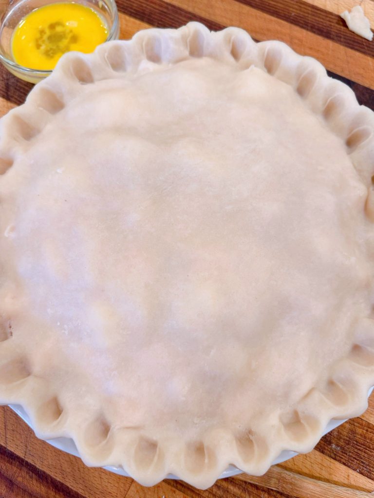 Pie crust fluted around the edges.