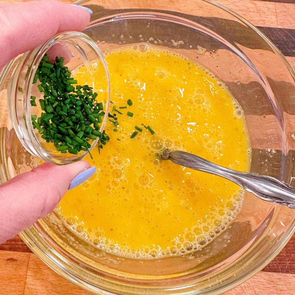 Add chopped fresh chives to the egg batter.