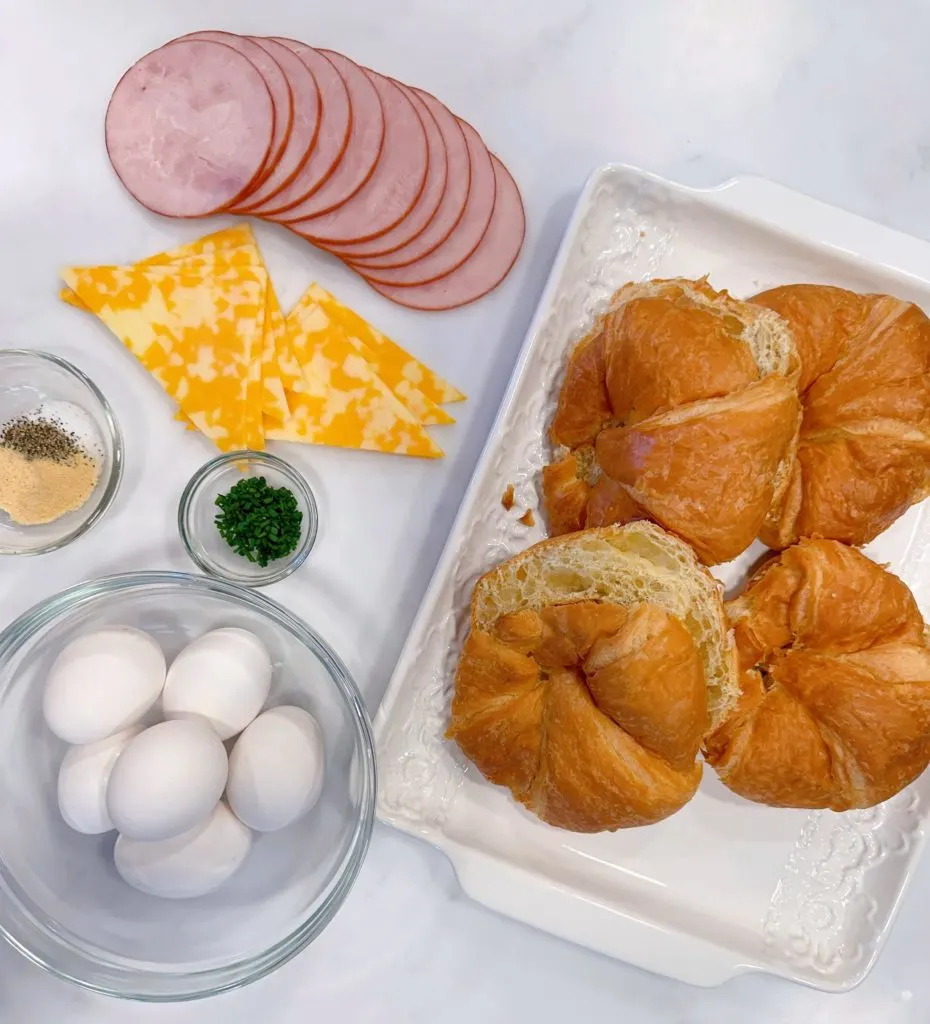 Photo of ingredients on the countertop for breakfast croissant sandwiches.