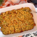 Baked cornbread dressing in baking dish.