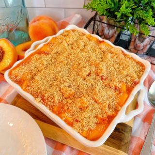 Layered Peach delight dessert in a baking dish ready to serve.