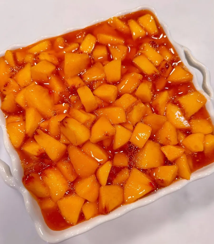 Peach layer applied to delight dessert.