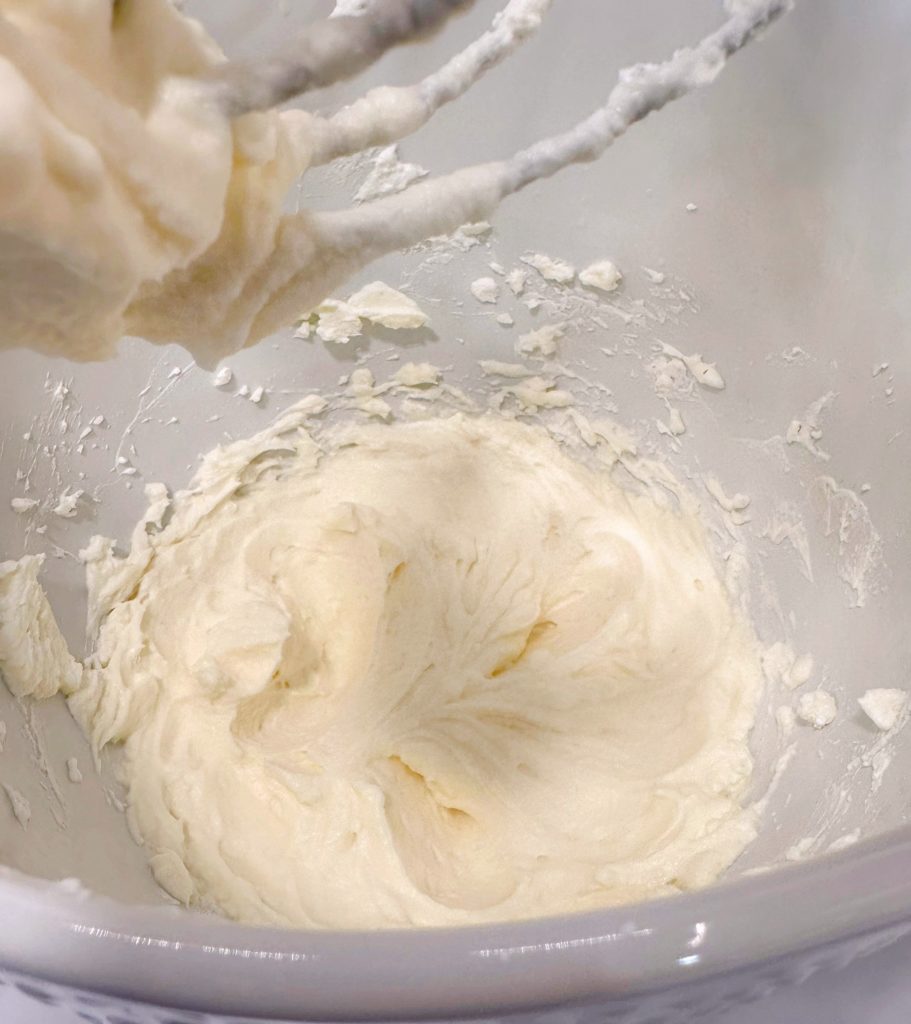 Whipped cream in mixing bowl.