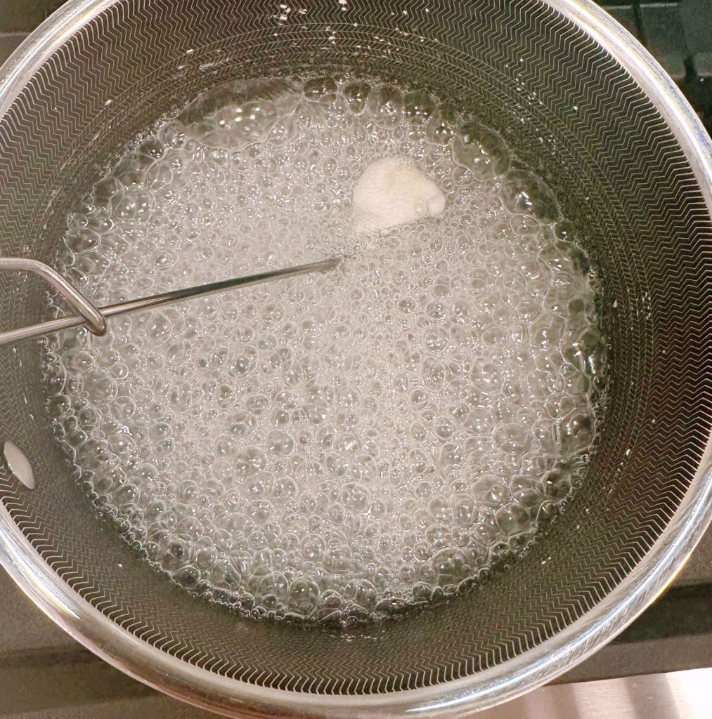 Sugar mixture in sauce pan, boiling.