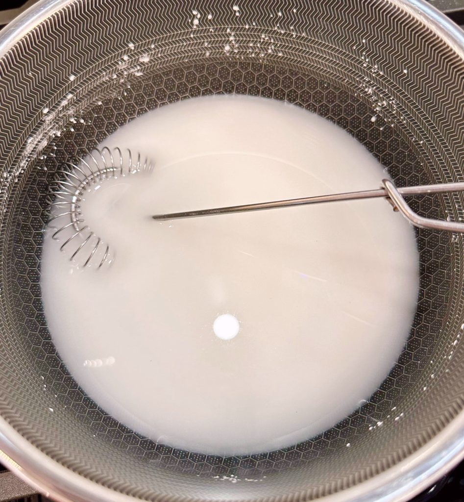 Ingredients in a sauce pan for peach glaze.