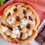 S'mores air fryer dip in a halloween dish with cookies and crackers for dipping.