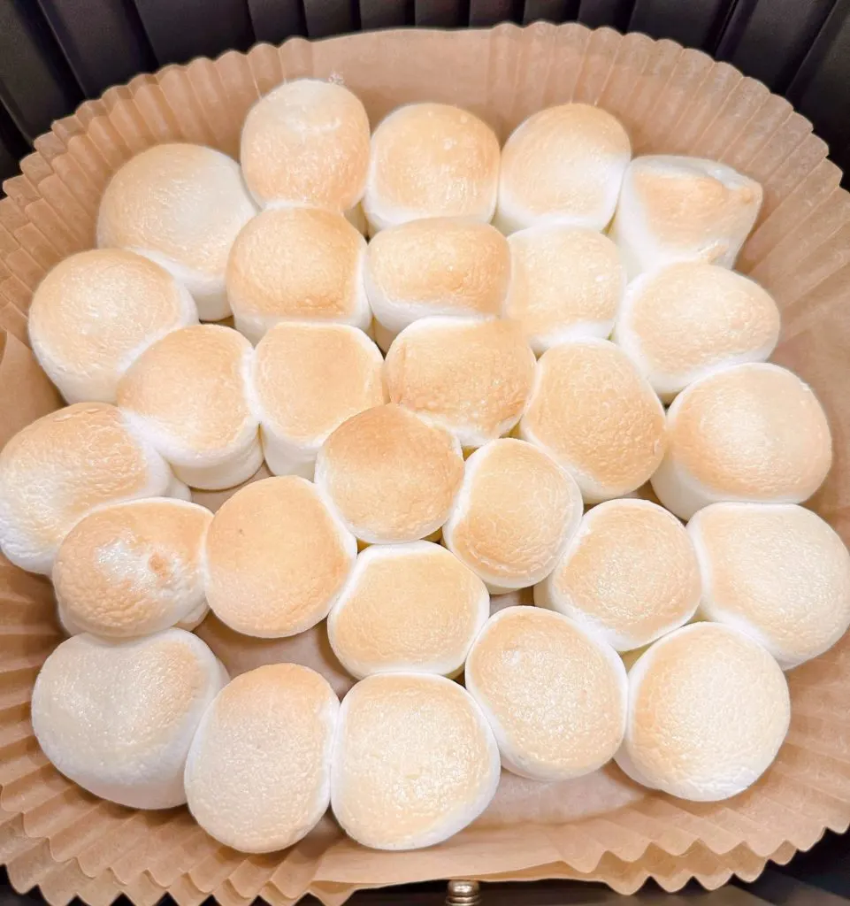 Toasted marshmallows in the liner of the air fryer.