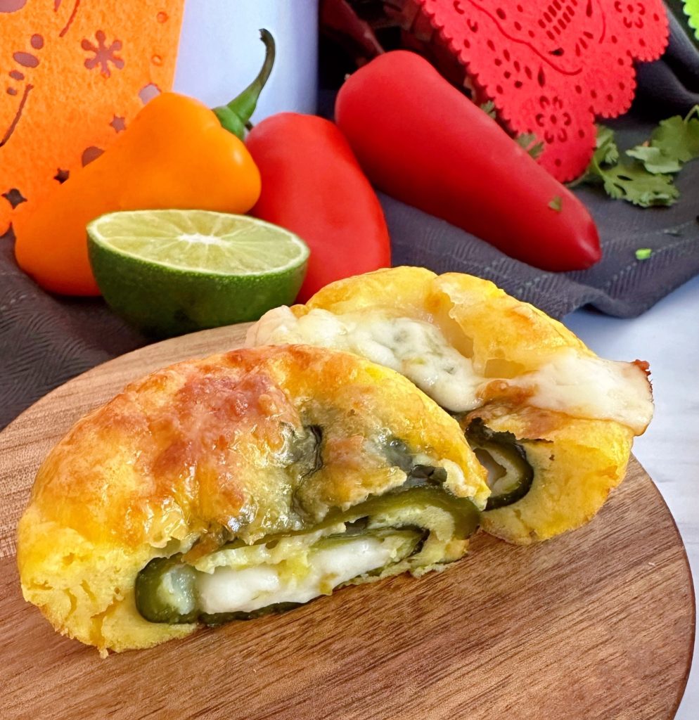 Chile Relleno Bite cut in half to show how it is stuffed with cheese.