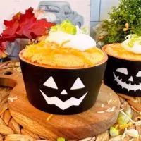 Individual Chili Cornbread cup on a small cutting board.