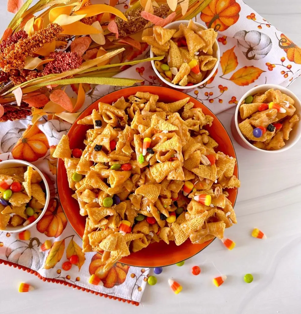 Snack mix in serving bowl and individual serving cups.