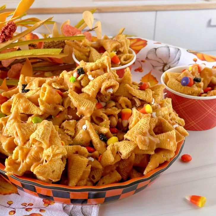 Bowl full of Halloween Bugles Crack with candy corn, and halloween candies.