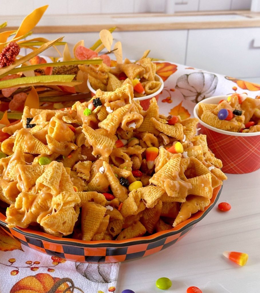 Bowl full of Halloween Bugles Crack with candy corn, and  halloween candies.