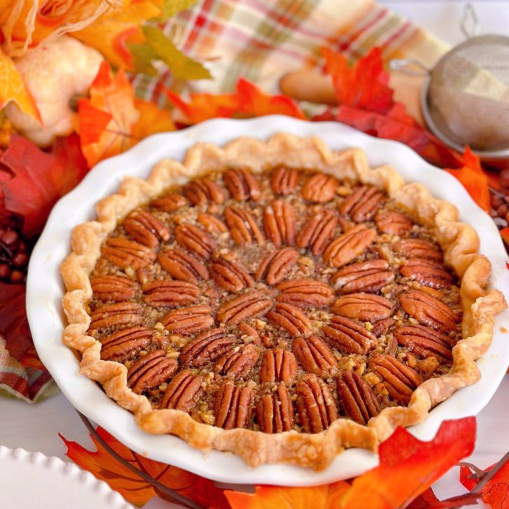 Pecan Pie with beautifully arranged pecans on top.