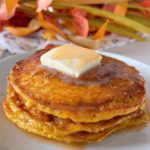 Pumpkin swirl pancakes with syrup and butter.