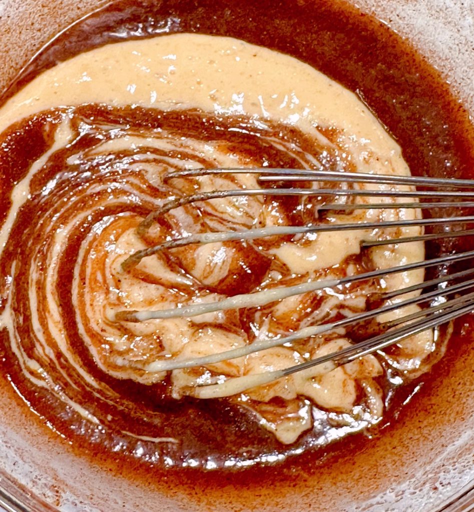 Cinnamon Filling mixture being mixed in a bowl.