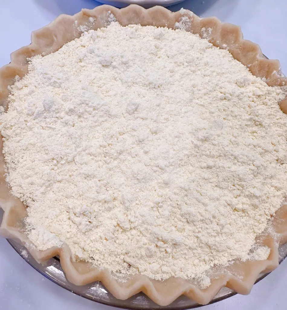 Cake mix sprinkled over pumpkin batter in the pie shell.