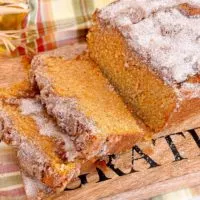 Sweet Potato Cinnamon Bread sliced on a cutting board ready to eat.