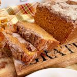 Sweet Potato Cinnamon Bread sliced and on a cutting board.