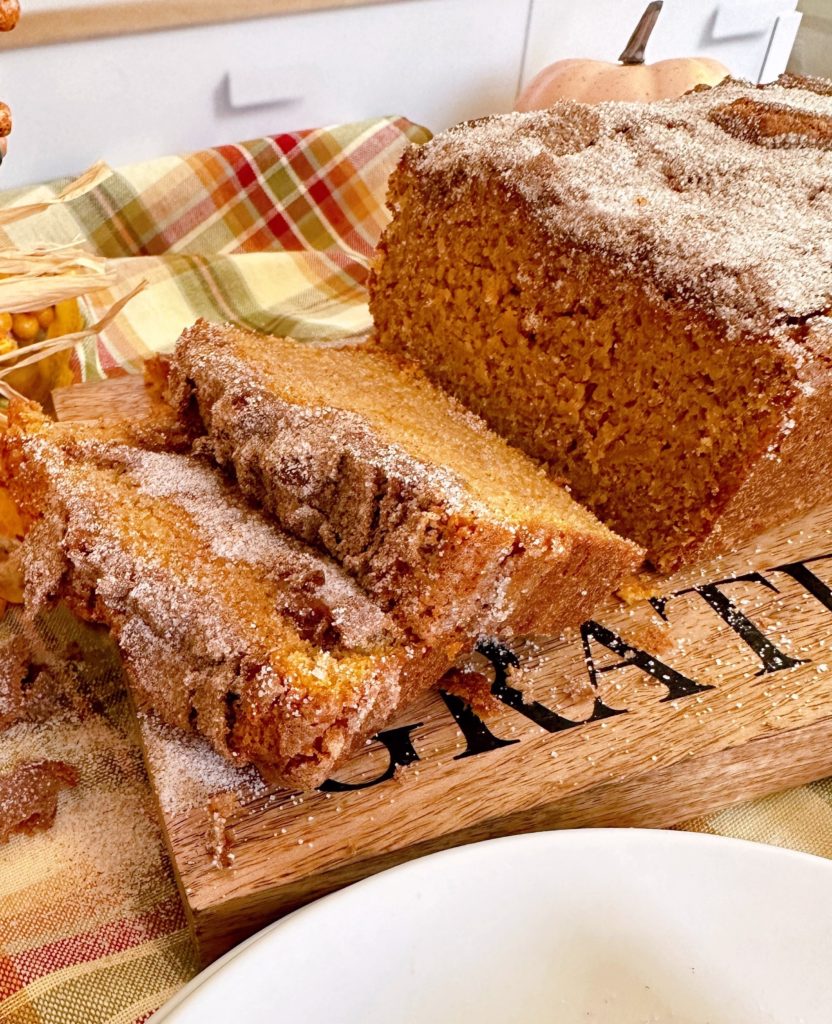 Sweet Potato Cinnamon Bread sliced and on a cutting board.