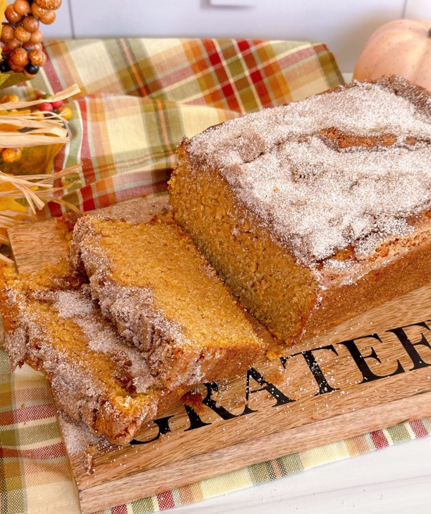 Sliced Sweet Potato Bread with cinnamon topping on a board.