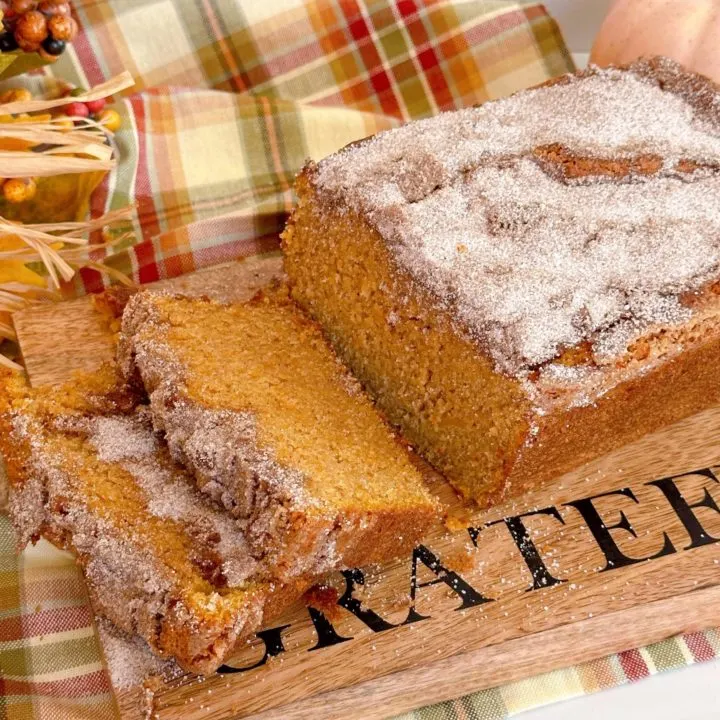 Sliced Sweet Potato Bread with cinnamon topping on a board.