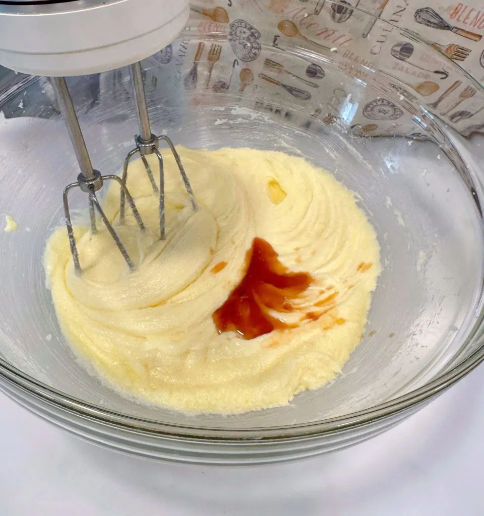 Creaming butter and sugar in mixing bowl add vanilla.