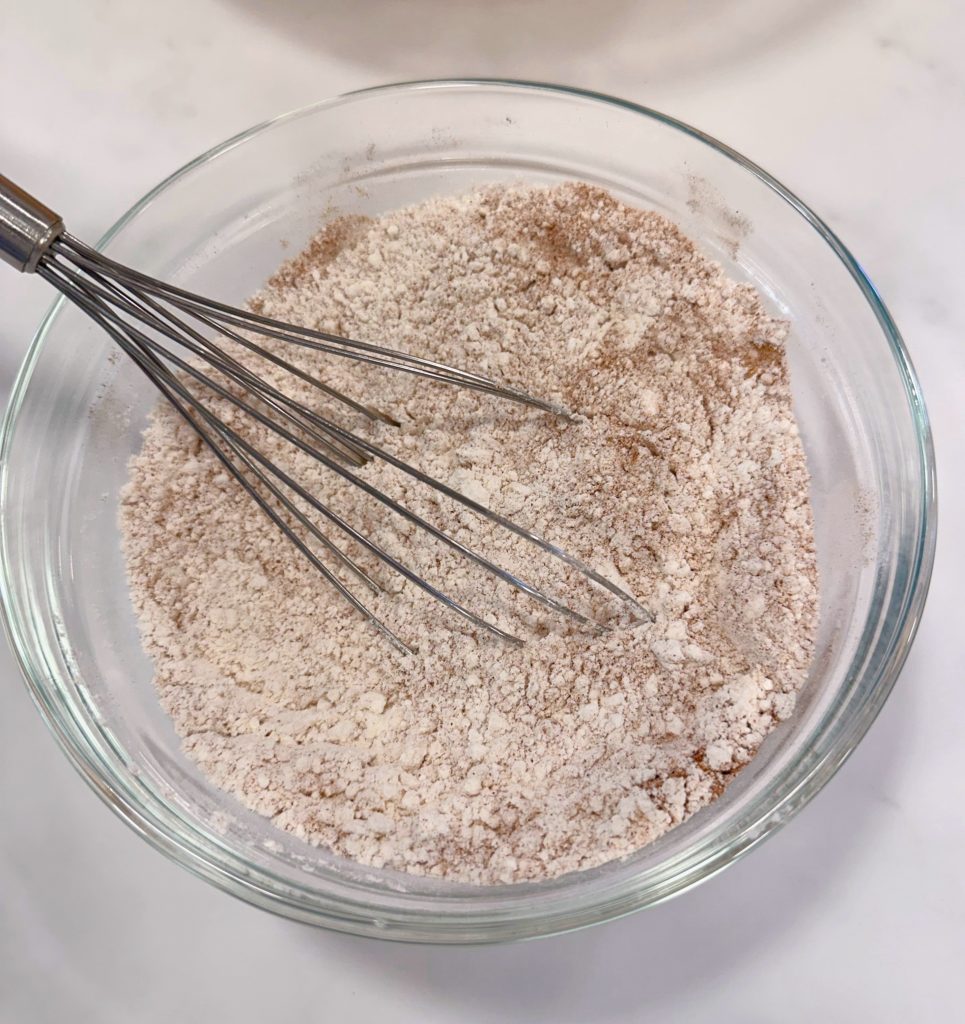 Dry ingredients whisked together in a bowl.