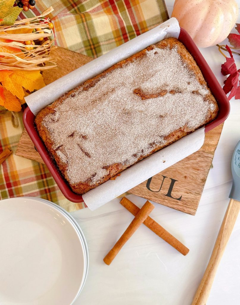 Baked loaf of sweet potato bread with cinnamon crunch topping.