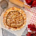 Apple Almond Galette on a cooling rack cooking with the glaze drizzled over the top.