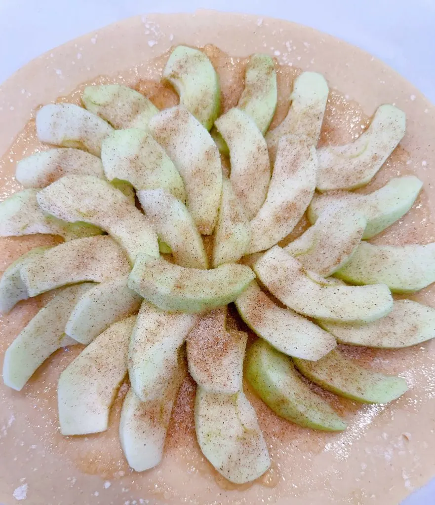 Cinnamon Sugar sprinkled over the apples on the pie crust.