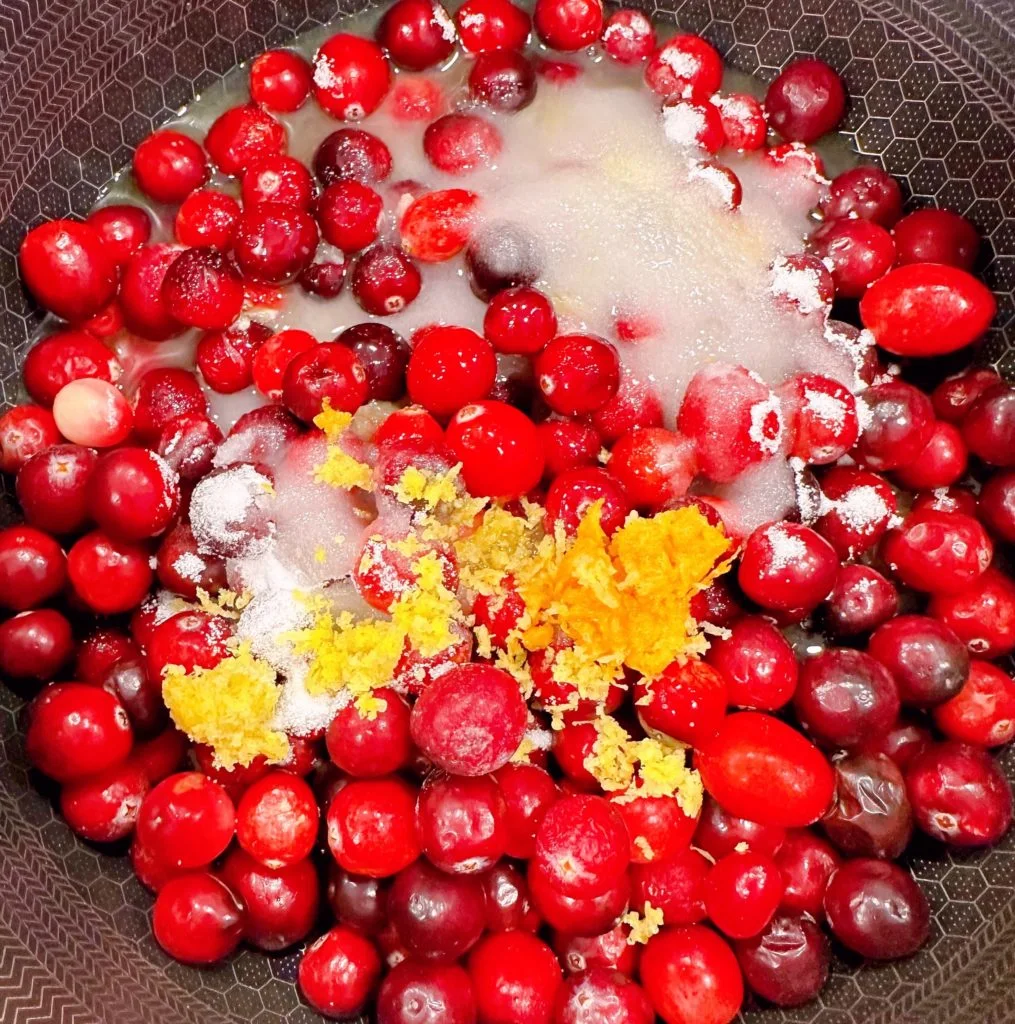 Cranberries, sugar, orange zest and water in a large sauce pan.