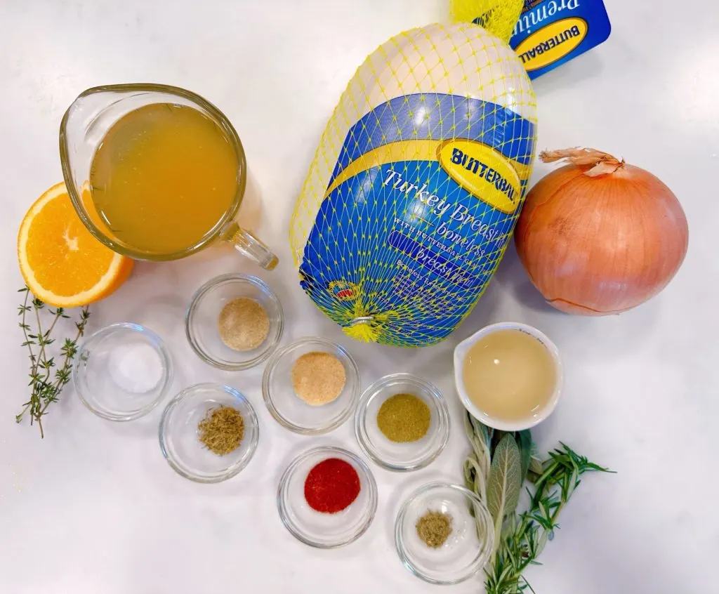 Slow Cooker Turkey ingredients on a white kitchen counter.