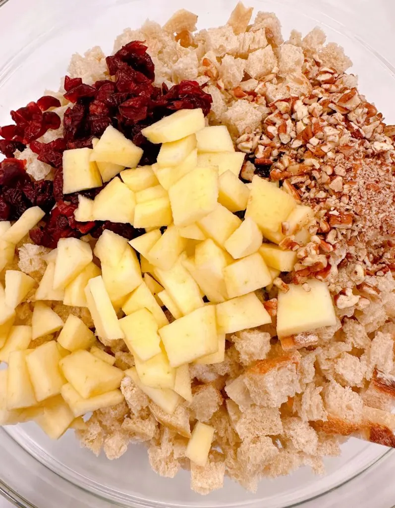 Diced apples, dried cranberries, and pecans are added to stuffing mixture.