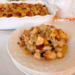 Baked sausage sourdough stuffing with cranberries and pecans.