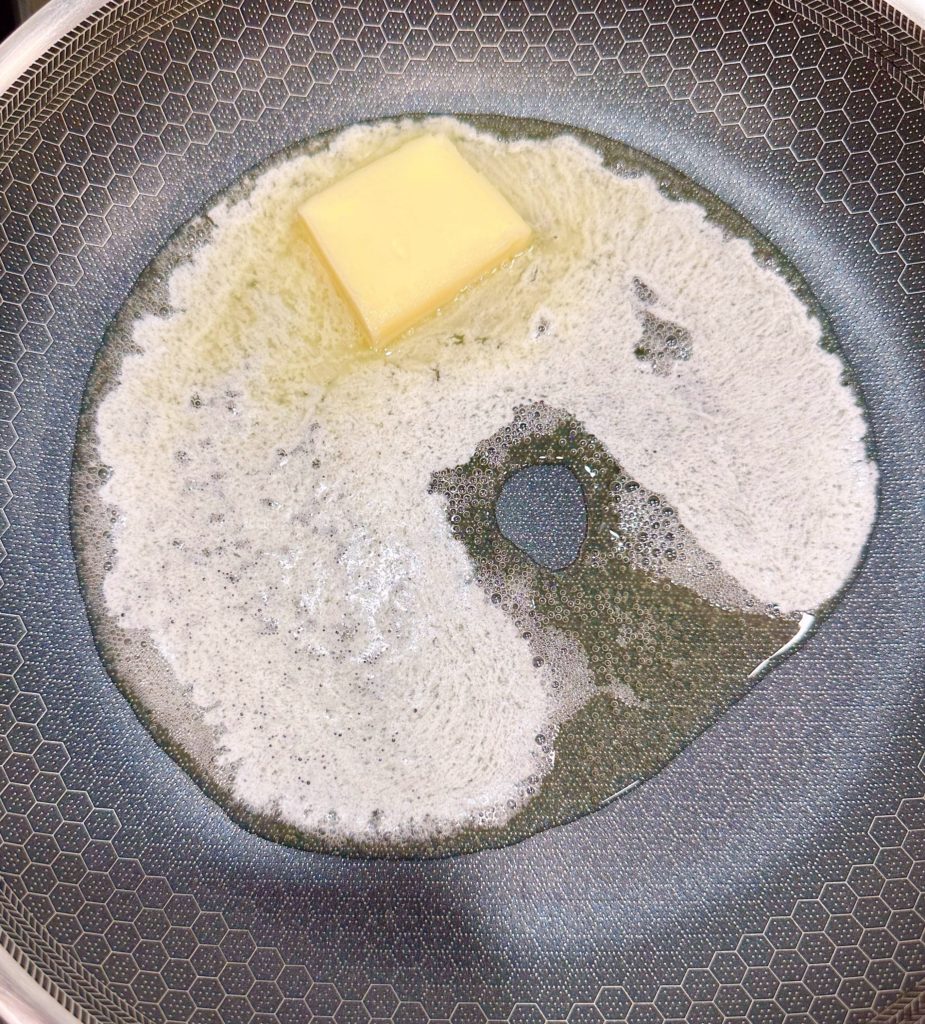 Melting butter in large skillet over medium heat.