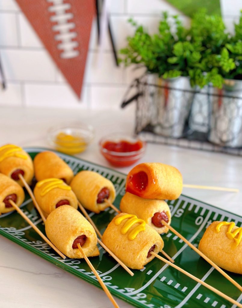 Easy two ingredients mini corn dogs with mustard and ketchup.