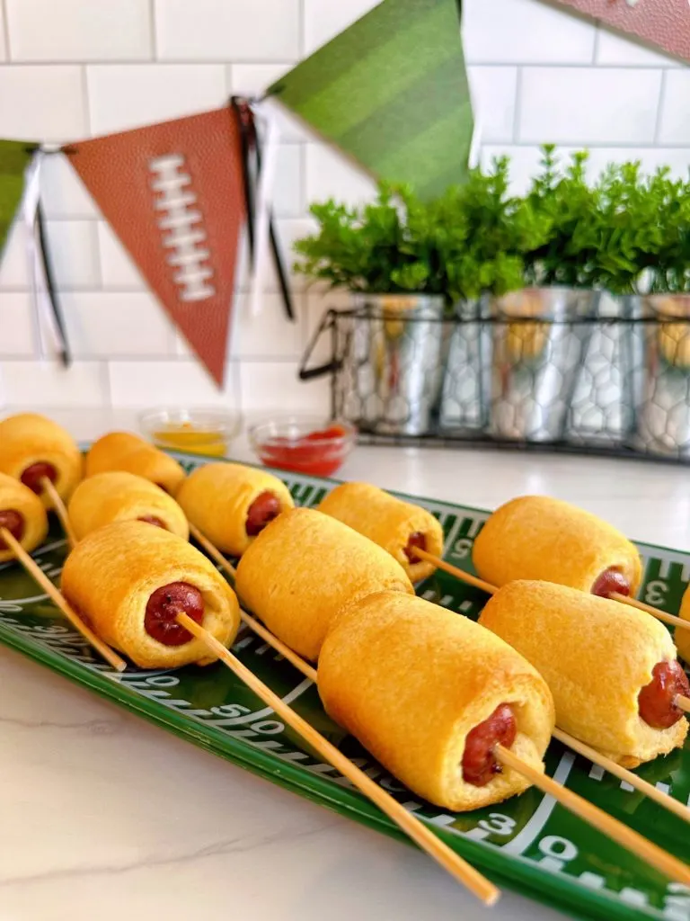 Baked mini corn dogs on a stick.