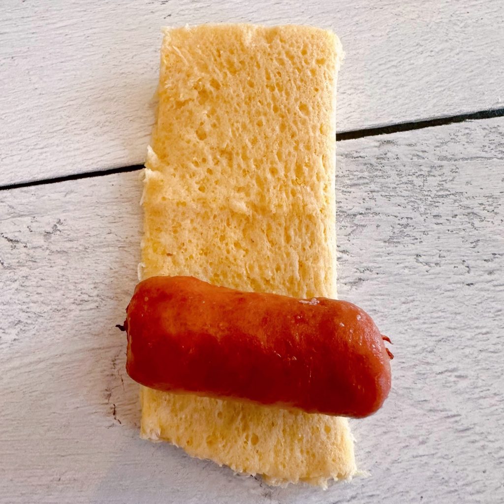 Corn dog wraps cut into sqaures to wrap around a mini little smokie.