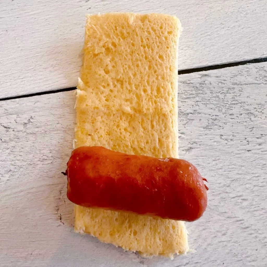 Corn dog wraps cut into sqaures to wrap around a mini little smokie.