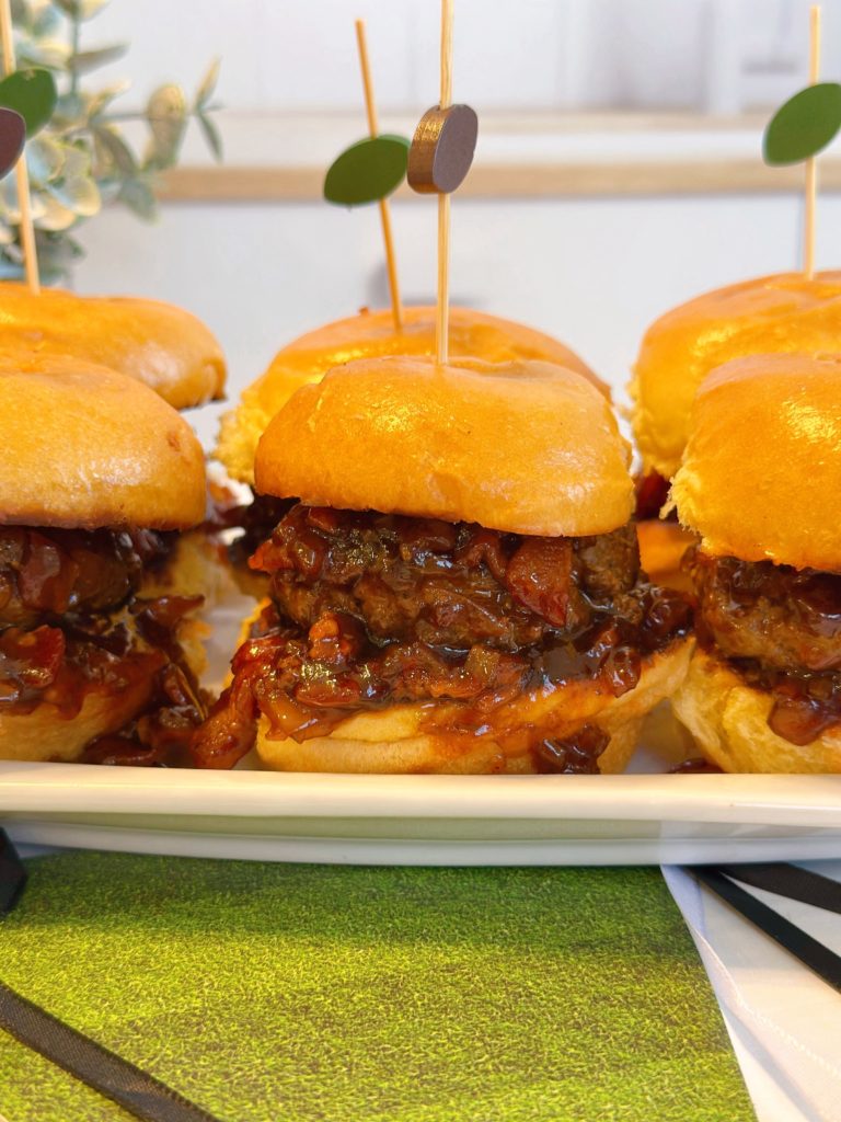 Whiskey Bacon Onion Burgers on a serving plate.