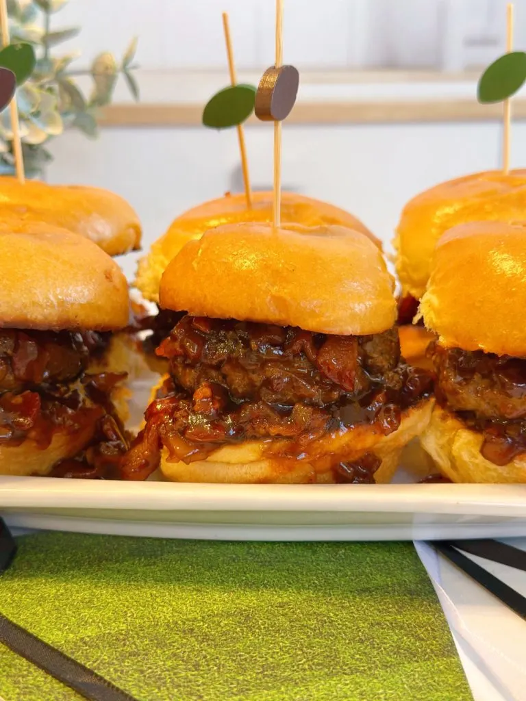 Whiskey Bacon Onion Burgers on a serving plate.