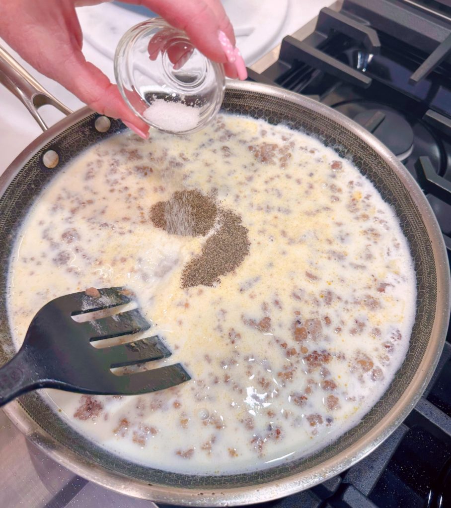 Adding seasoning to the gravy mixture.