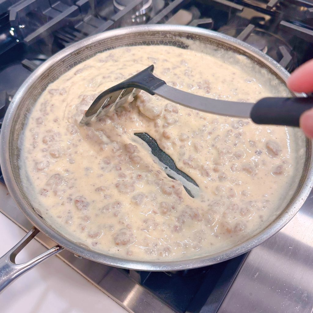 The gravy mixture thickens on the stove top.