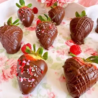 Easy Homemade chocolate dipped strawberries on a pretty plater.