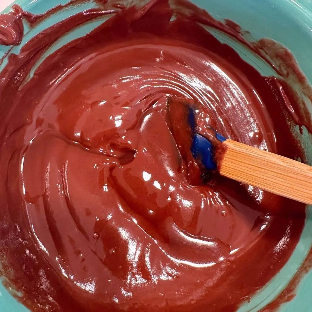 Chocolate melted in a microwave-safe bowl.