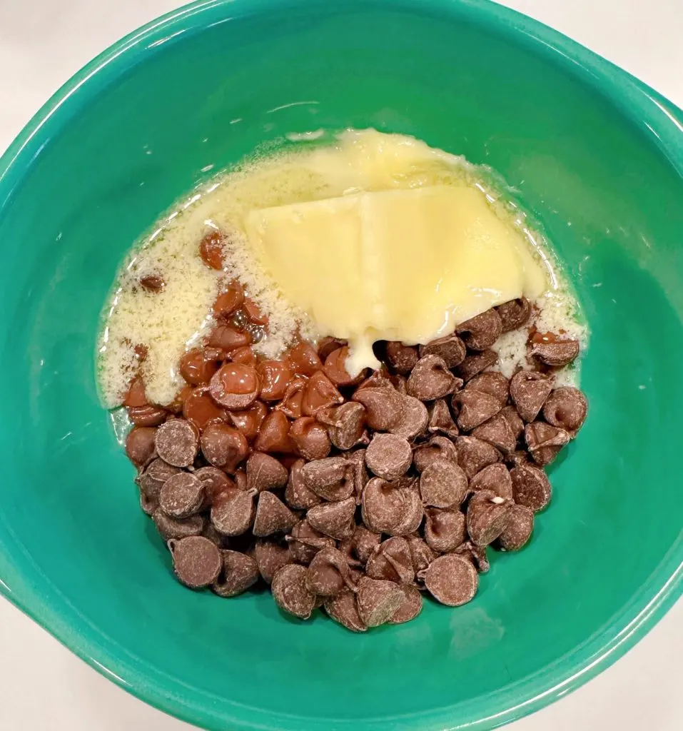 Bowl with chocolate chips, butter, and corn syrup.