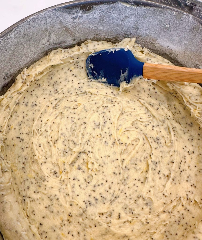 Spread the batter in the greased and floured pan.