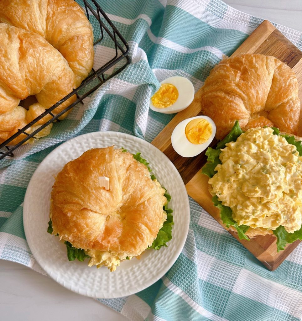 Egg Salad in a sandwich and on greens. 